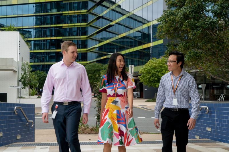 Employees walking in front of office building