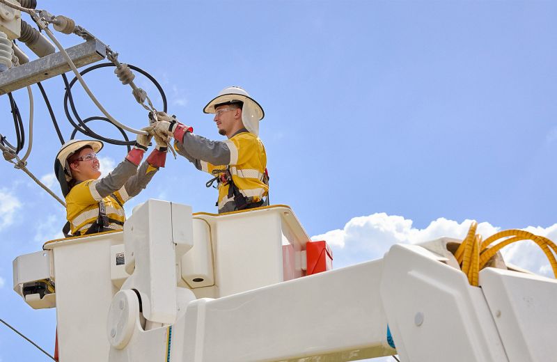 Two field crew working on powerlines in truck