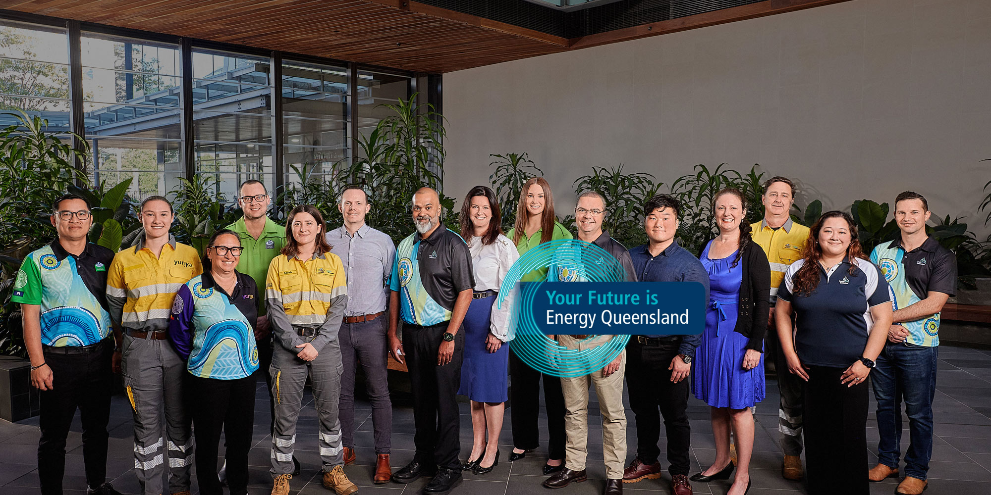 Group of employees in building foyer in different uniforms