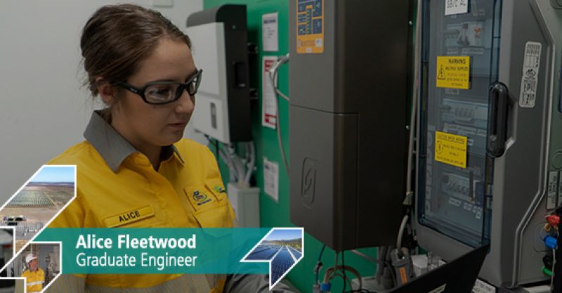 Energy Queensland employee Alice Fleetwood looking at electrical equipment