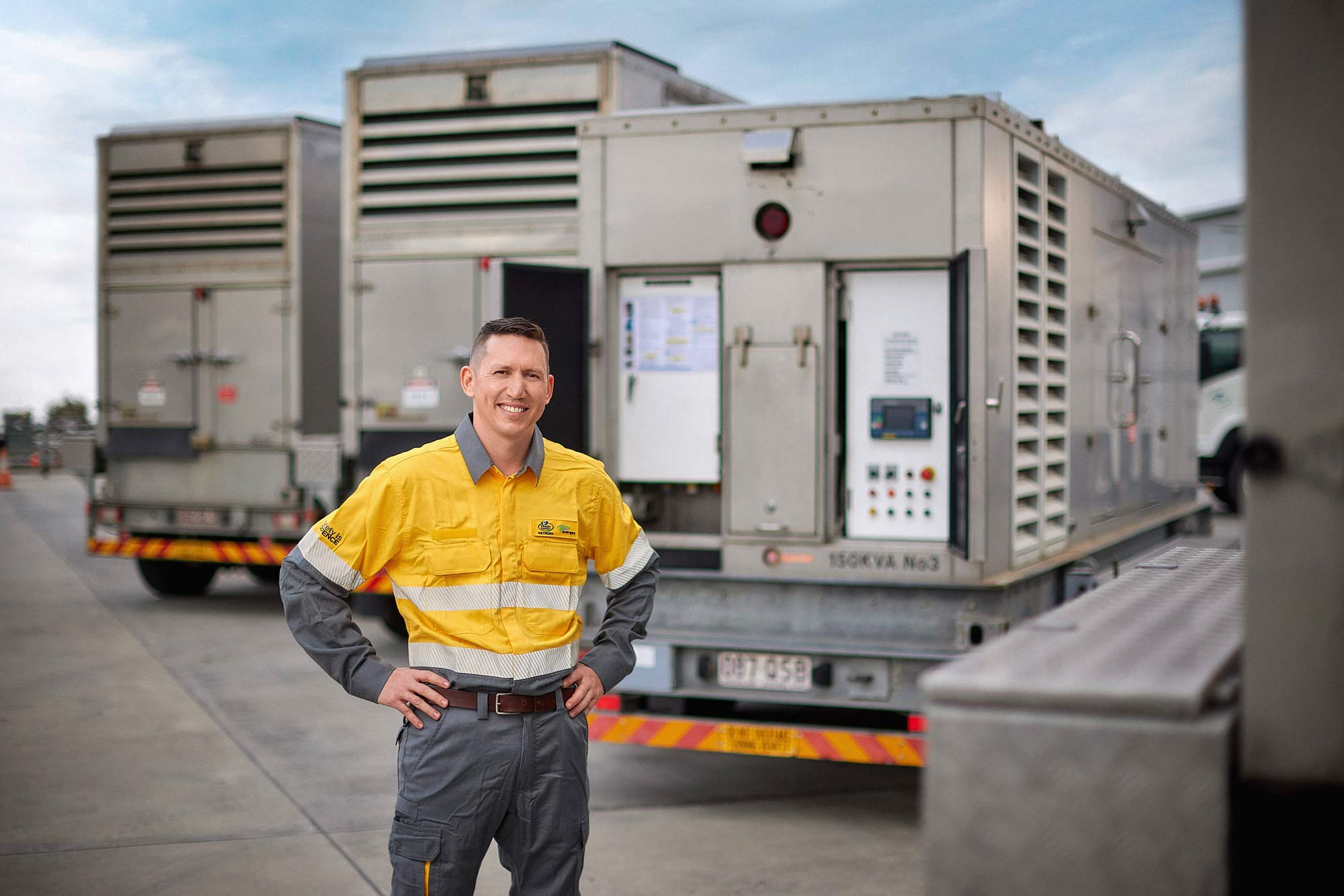 Worker in front of generators