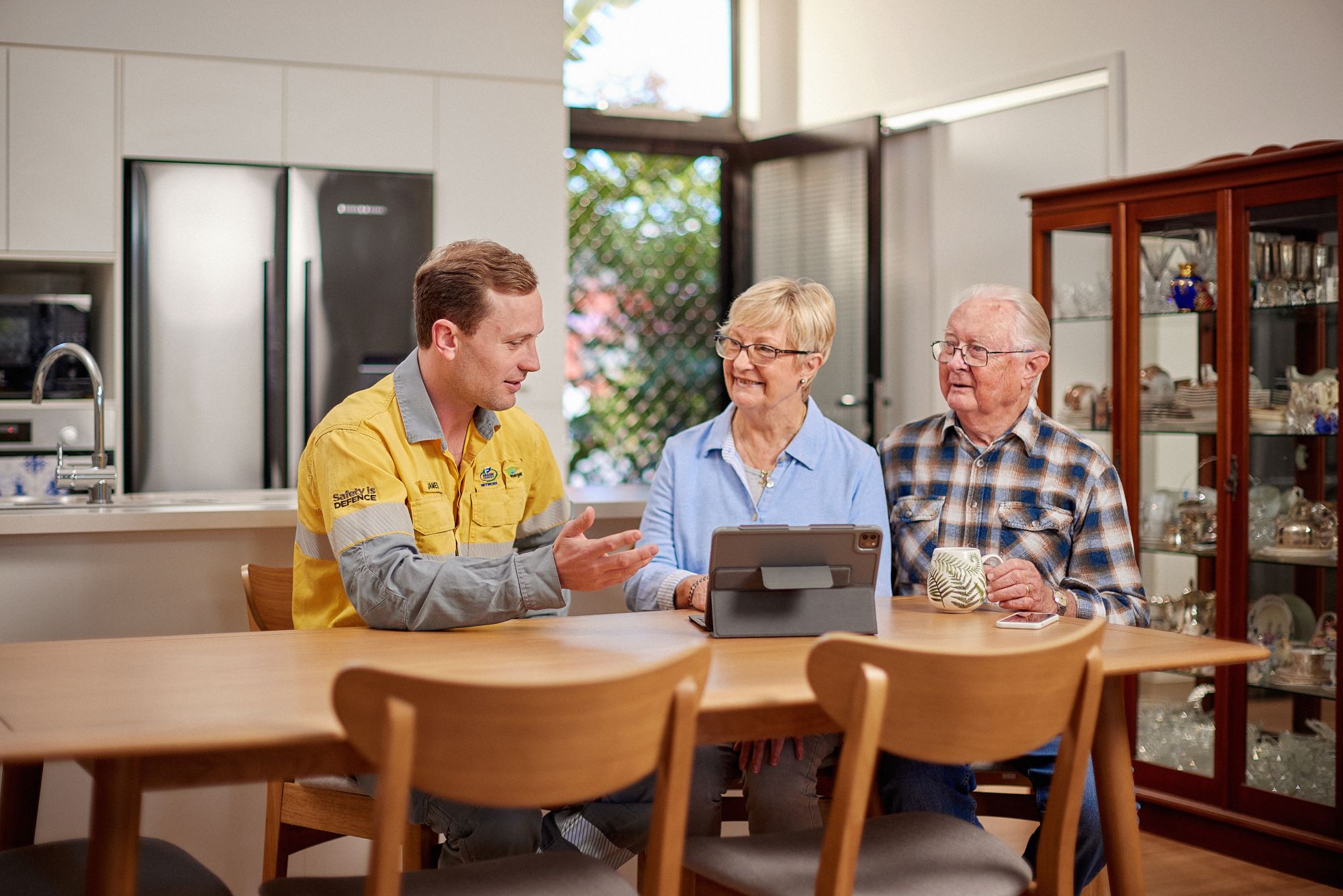 Employee talking to customers at table