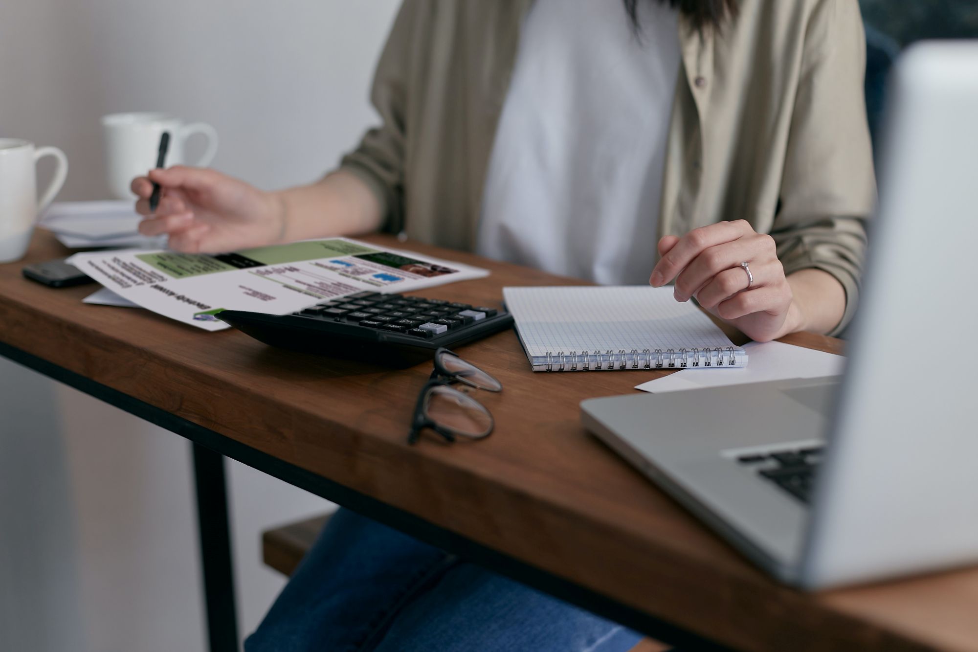 Lady calculating a bill at desk